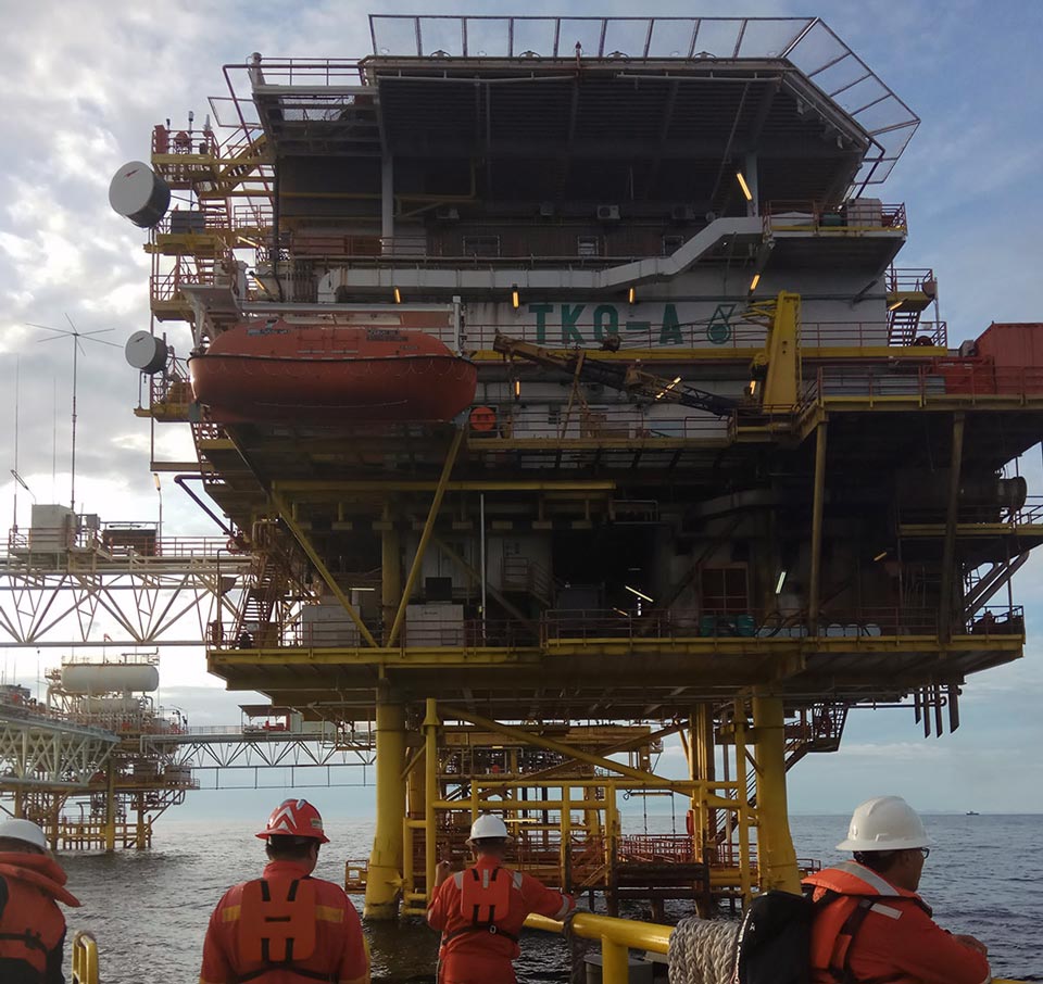 Artificial lift services team preparing to board an offshore platform